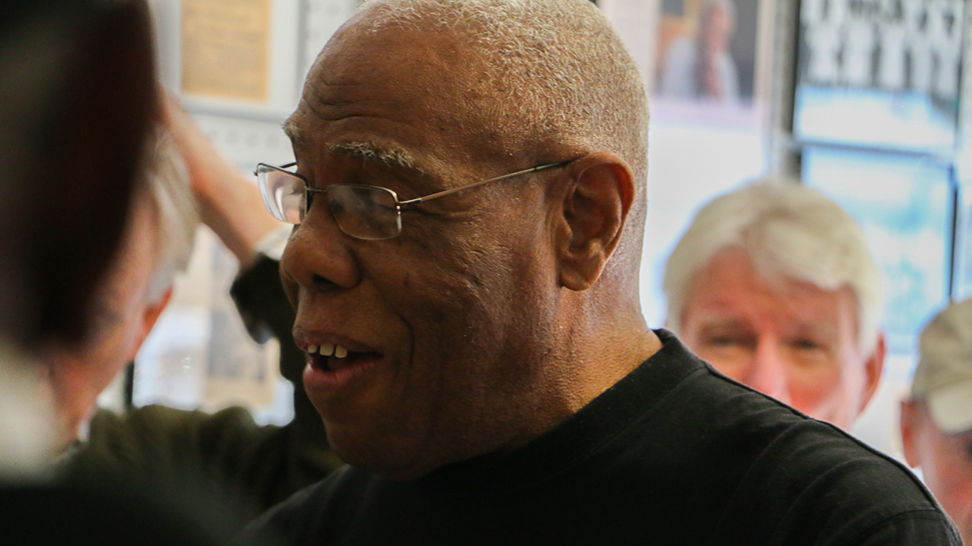 
Jetson Grimes speaking to a tour group visiting his Newtown Historical Gallery allery on Osprey Avenue (Photo: Visit Sarasota County)
