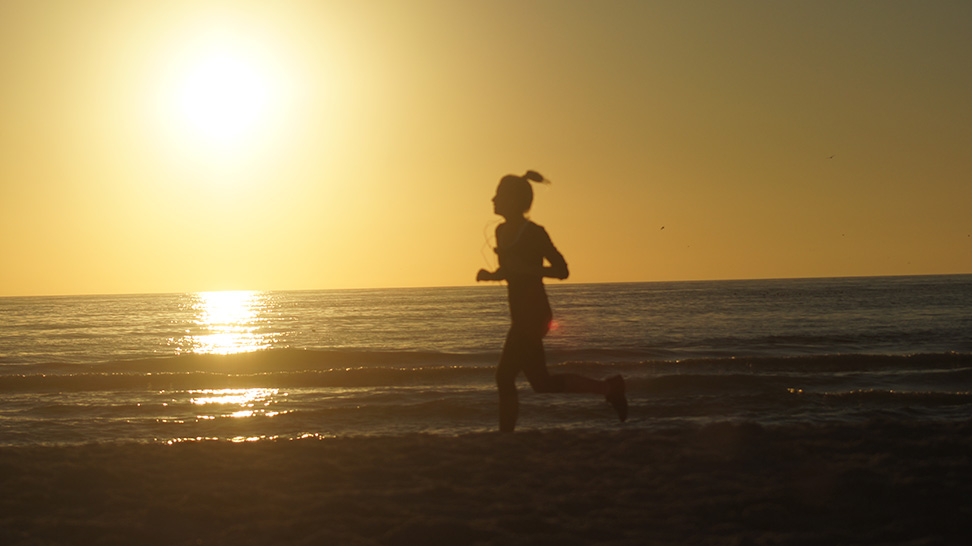 Running on the on Siesta Beach at Dusk can be a beautiful way to burn calories