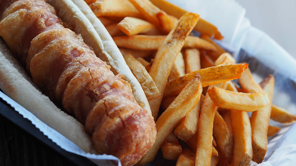 The namesake menu item at Old Salty Dog – a fried hotdog! [Photo: Lauren Jackson]