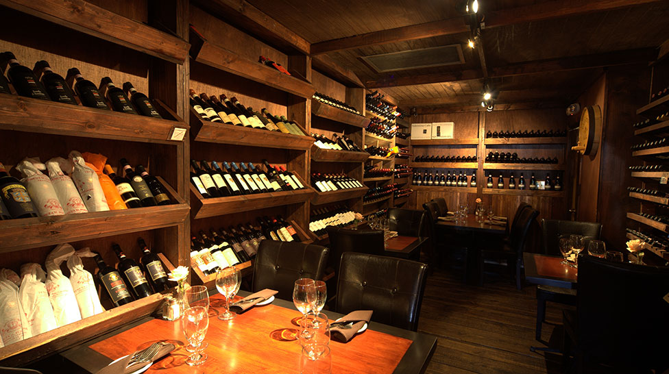 Custom wine cellar and seating at Café Gabbiano