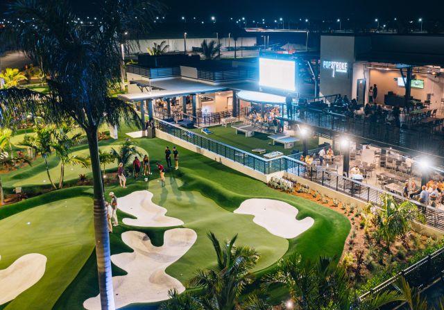 
Overhead nighttime view of PopStroke Golf arena
