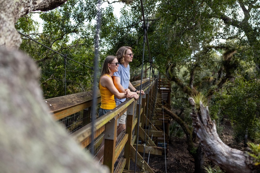 couple on canopy walkway in myakka state park
