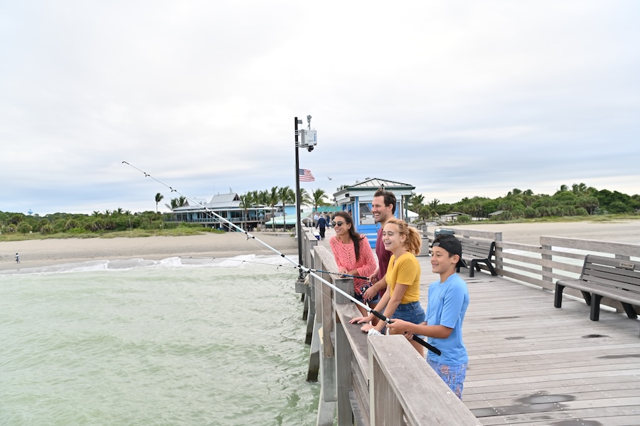 young family fishing off the pier in venice florida