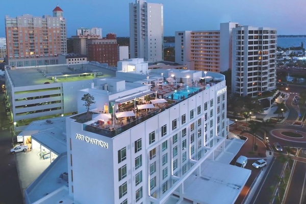 the rooftop of a downtown sarasota hotel at night