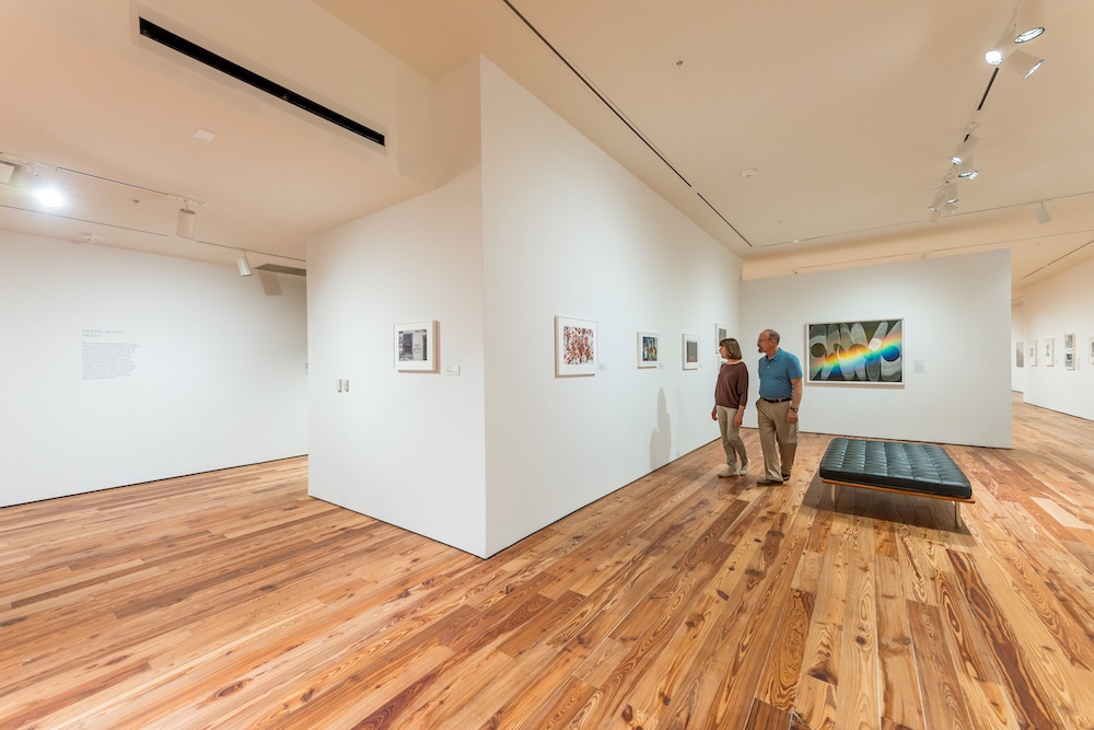 older couple perusing art at sarasota museum
