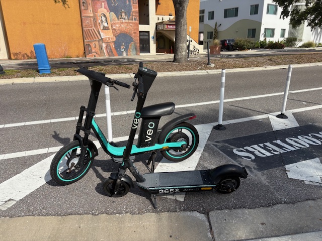 downtown sarasota scooters on the side of the street