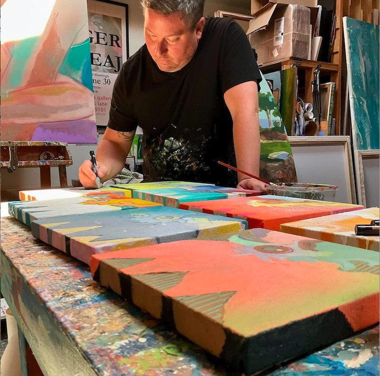artist jaeger in his 502 gallery studio painting