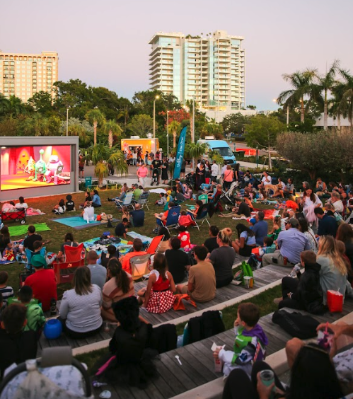 families watching movie at the bay park