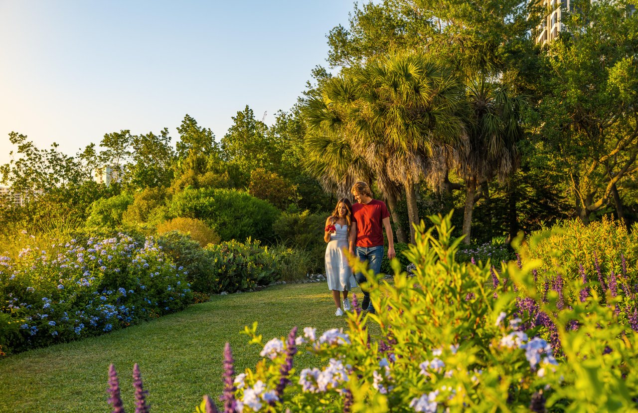 young couple walking through selby gardens