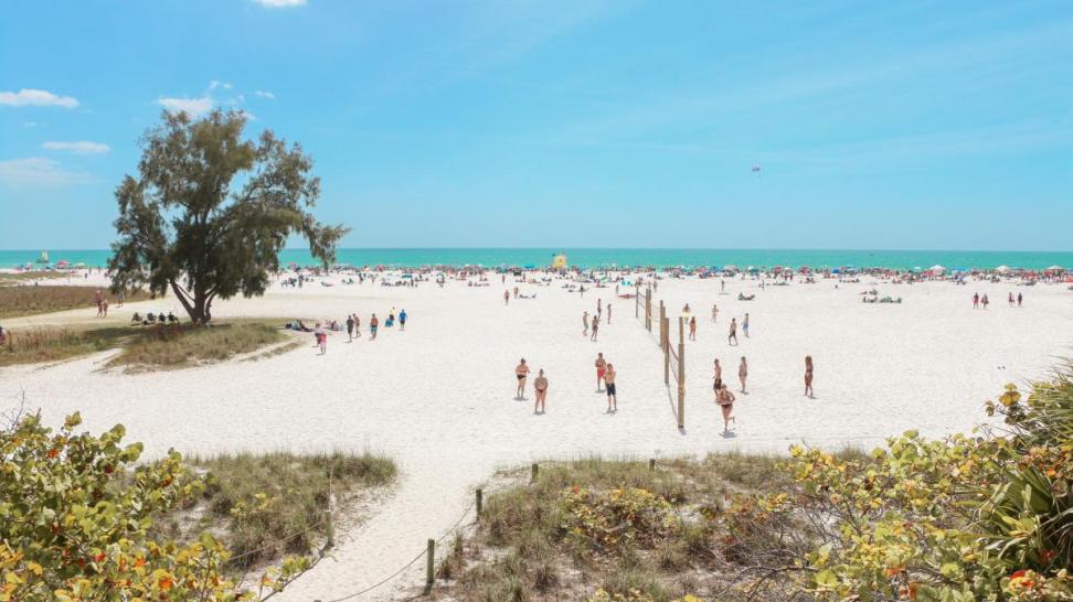 playing beach volleyball on siesta key during spring break