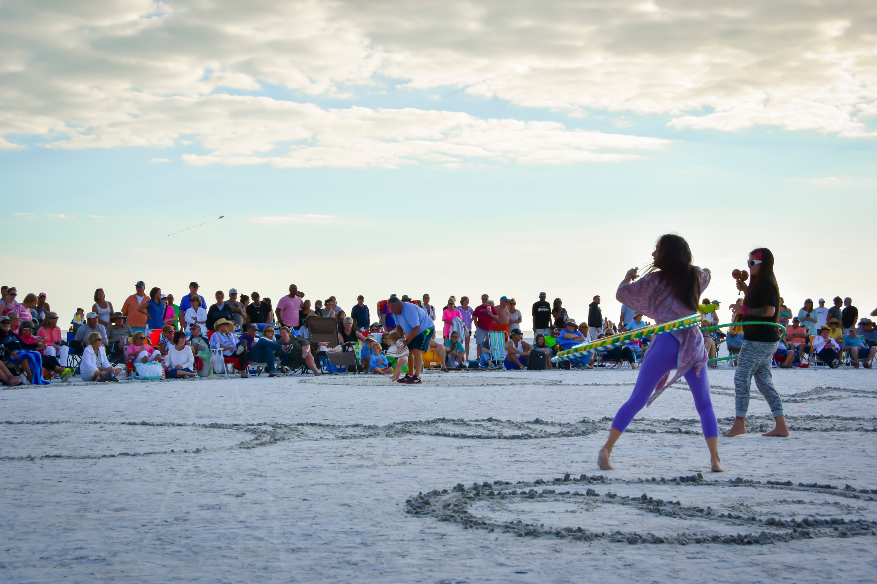 siesta key drum circle with families at sunset