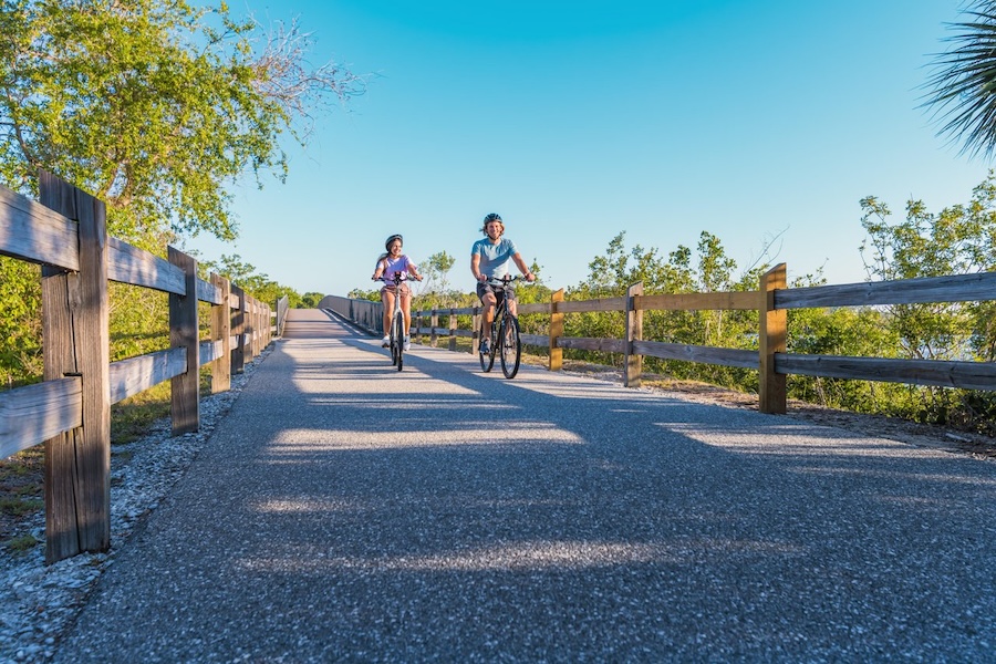 couple biking the legacy trail in sarasota county