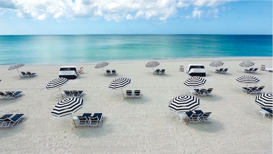 umbrellas and chairs outside of the resort at longboat key