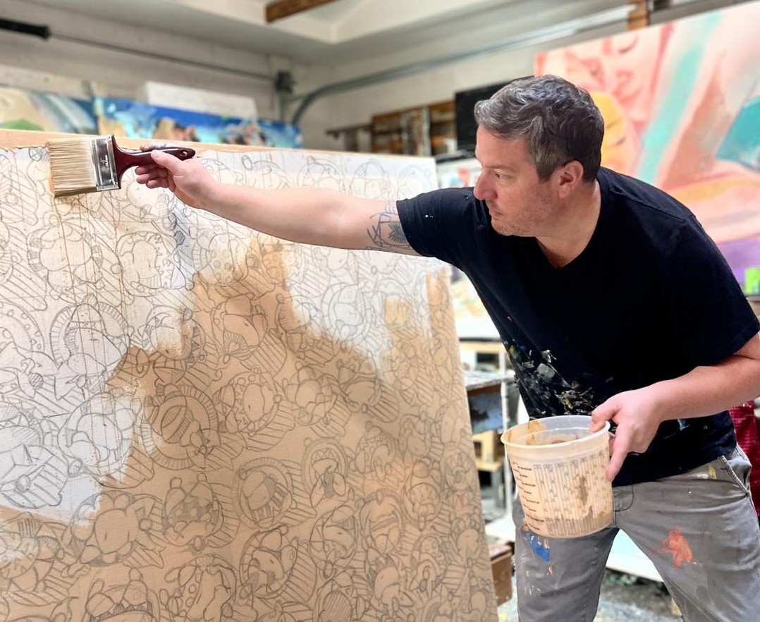 tim jaeger painting on canvas at his studio in sarasota