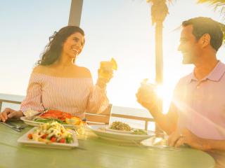 Couple toasting at Fins at Sharky's in Venice