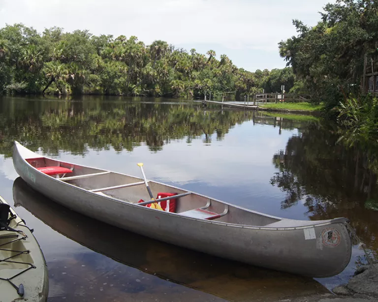 Idle canoes at Snook Haven.  Photo credit: Robin Draper