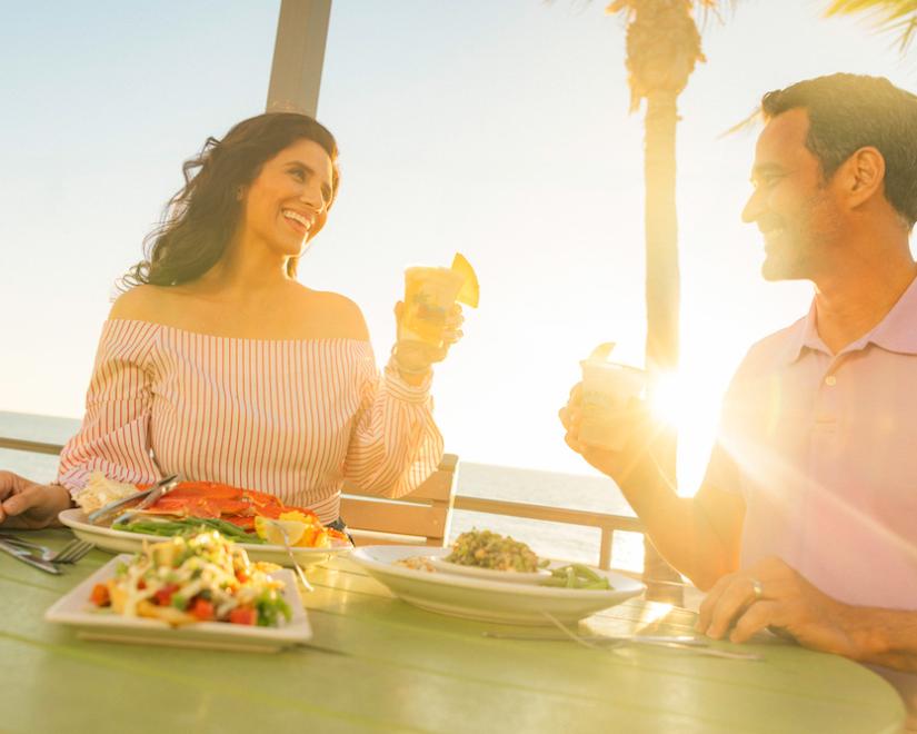 Couple toasting at Fins at Sharky's in Venice
