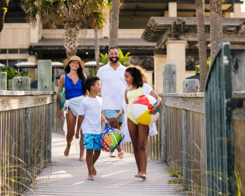 family walking to beach from ritz carlton sarasota