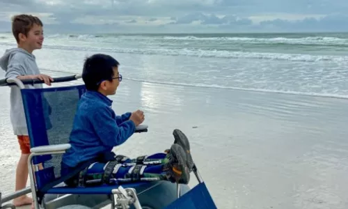 Child in beach wheelchair