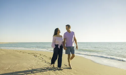 couple walking on a sarasota beach