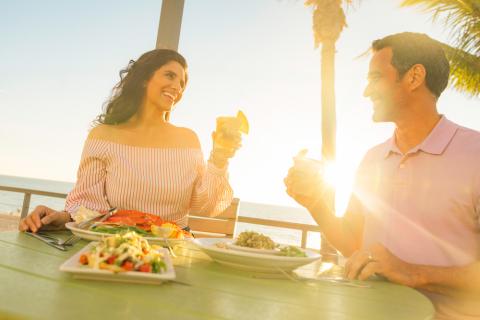 Couple toasting at Fins at Sharky's in Venice