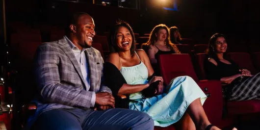 couple laughing inside the theater in sarasota
