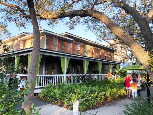 Towles Art Center Porch - Three restaurants at Towles! Bodhi Tree Cafe (here on the porch of the Art Center) Shoogie Boogie Garden Cafe (on the courtyard) and Indigenous (located at Links and Adams)