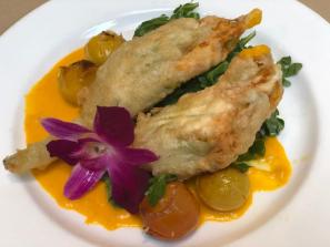 Artichokes Esther - crispy artichoke hearts, tomato, lemon, caper butter, aged Parmesan
