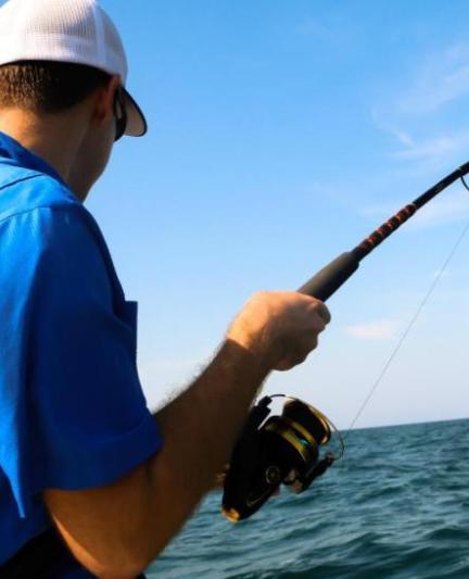 Man fishing off boat in the Gulf