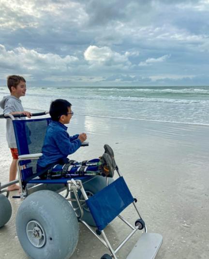 Child in beach wheelchair