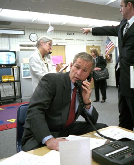 George Bush gathers information about the 9/11 attacks in a classroom at Emma E. Booker Elementary School in Sarasota on Sept. 11, 2001 [Photo: The U.S. National Archives]