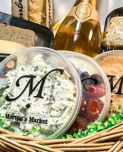 Picnic basket filled with items from Morton's Gourmet Market