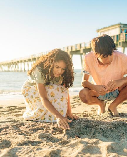 Kids looking for shells and shark teeth at Venice Pier