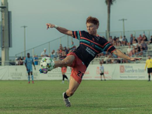 Sarasota Paradise player kicking a ball