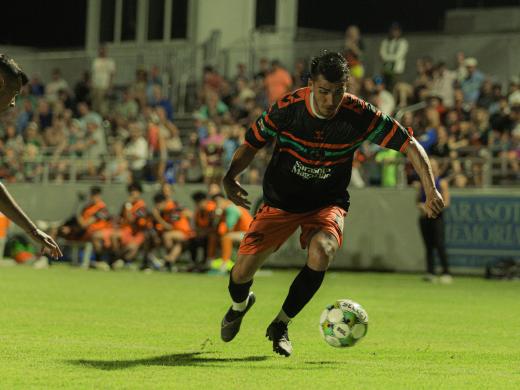 Sarasota Paradise player kicking a ball