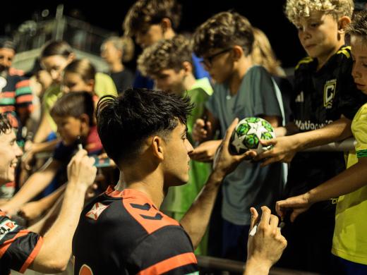 Sarasota Paradise players signing autographs