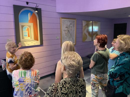 people viewing art on display at the Van Wezel
