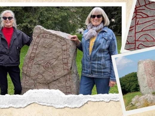 2 people posing with runestone, stones with carved rune inscriptions