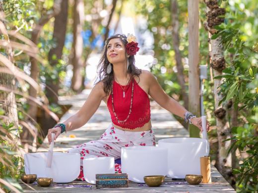 ZEN Seraphine playing crystal singing bowls outdoors