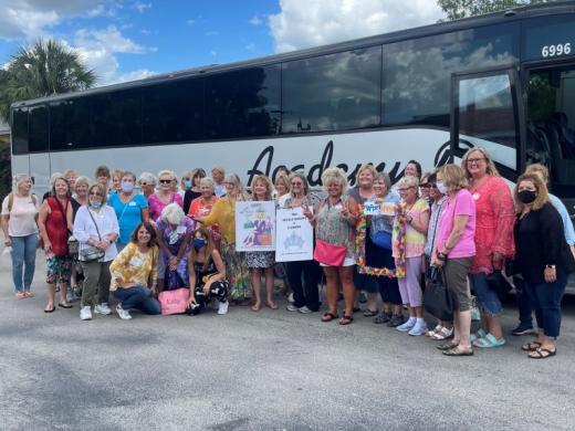 Gals in front of the Bus - Mystery Resale Shopping Bus Tour- Gals in front of motor-coach bus. Photo 2