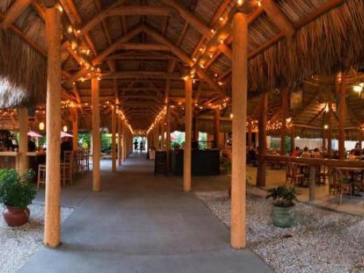 Iconic Chickee Hut Destination in Sarasota, Florida - The Iconic Stottlemyer Smokehouse is a Chickee Hut styled after the original native American chickee huts. The thatched roof allows air to pass... Photo