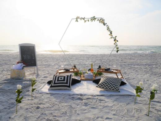 Romantic Picnic - Sunset beach picnic ideal for celebrations, relaxing or simply because. This picnic features our white hexagon backdrop, beautifully framing the scenery. Photo