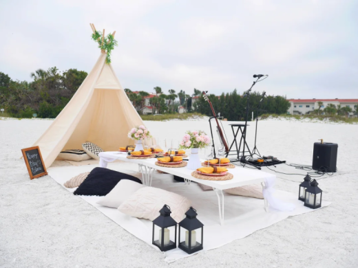 Beach Picnic Celebration - Elevate your celebration with a beach picnic. Including live music, eats and drinks and photography. Our tepee backdrop creates a sense of enclosure to the setup and a co... Photo 11