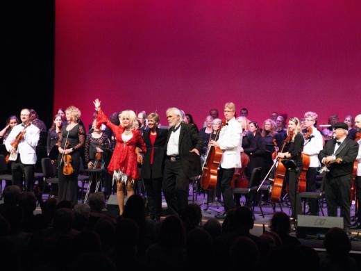 Guest Artists Kenny and Dolly - The Pops Orchestra regularly welcomes acclaimed guest artists for unforgettable tribute performances celebrating legendary entertainers like Kenny Rogers, Dolly Part... Photo 4