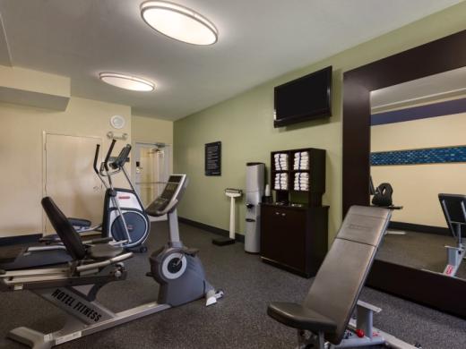 Work up a sweat - Calling all fitness enthusiast! Come jump start your day  in our fitness center. Photo 3