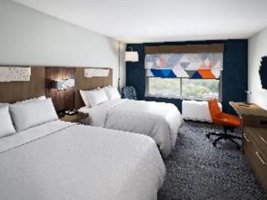 Holiday Inn Express Room - Standard Double Queen room is 319 square feet and features mini-fridge, microwave, Keurig coffee maker, black out shades and plenty of space to spread out and relax in. Photo