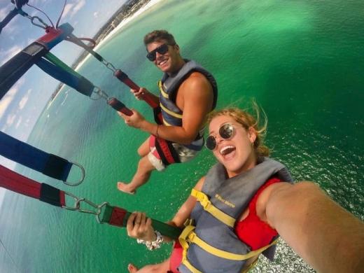 Parasailing Selfie Over Crystal-Clear Waters - Two guests capture an unforgettable parasailing selfie high above the crystal-clear waters of Siesta Key. With breathtaking Gulf views, peaceful fligh... Photo 7