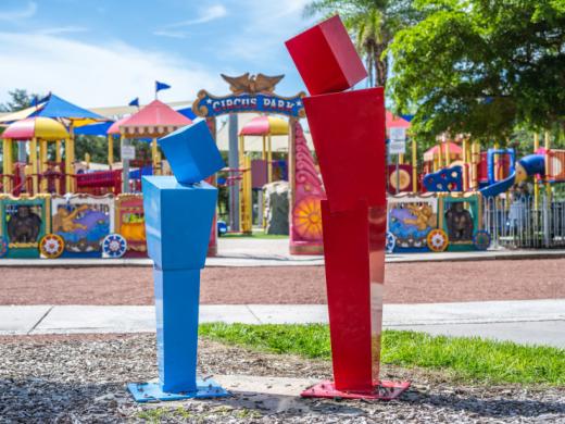 "Community Figures" by James Evans - Two figures made of cube-shaped forms, one red and the other blue. After being on loan to the City of Sarasota for one year as part of the "Intersections" proje... Photo 4