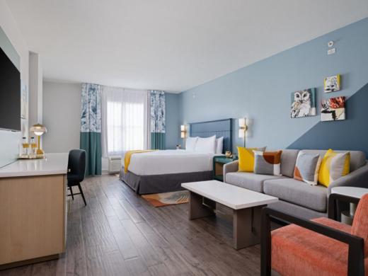 King Suite - King bed and living room area with sofa bed Photo 6