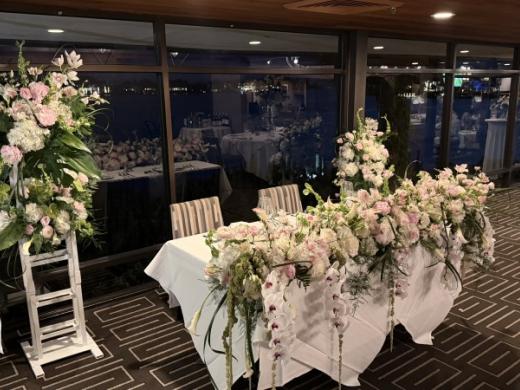Florida Luxury Head Table - Elegant head table with custom floral arrangement and statement floral stands,designed for a luxury Florida wedding reception Photo 8